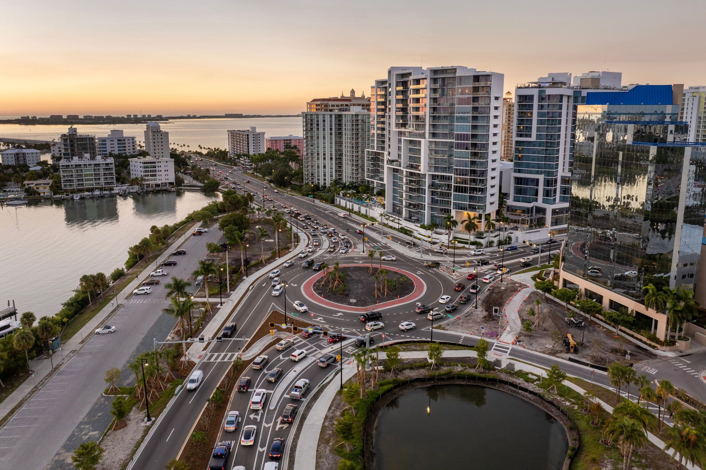 Aerial view of downtown Sarasota showing the roundabout, mid-rise buildings and the bayfront